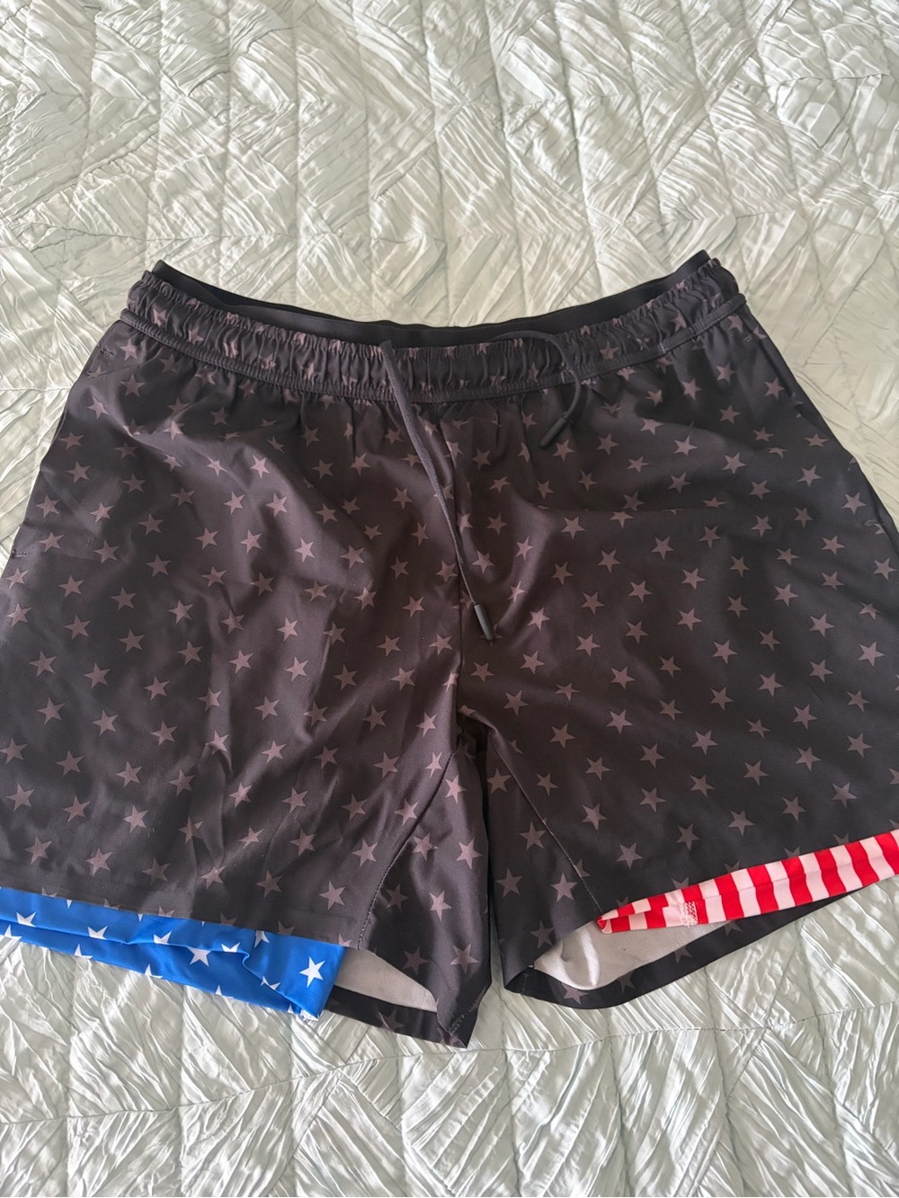 chubbies Black Star Print Athletic Shorts with Red & Blue Hem Accents